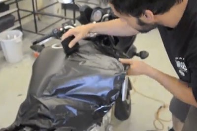 Applicator wrapping motorcycle
