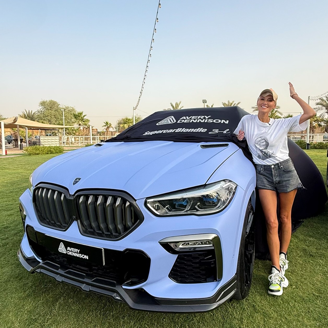 ad-gs-supercar-blondie-stands-next-to-her-reveal-of-supreme-wrapping-film-in-matte-dreamline-blue