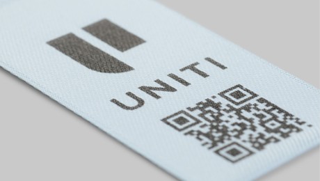 Care and content label with QR code